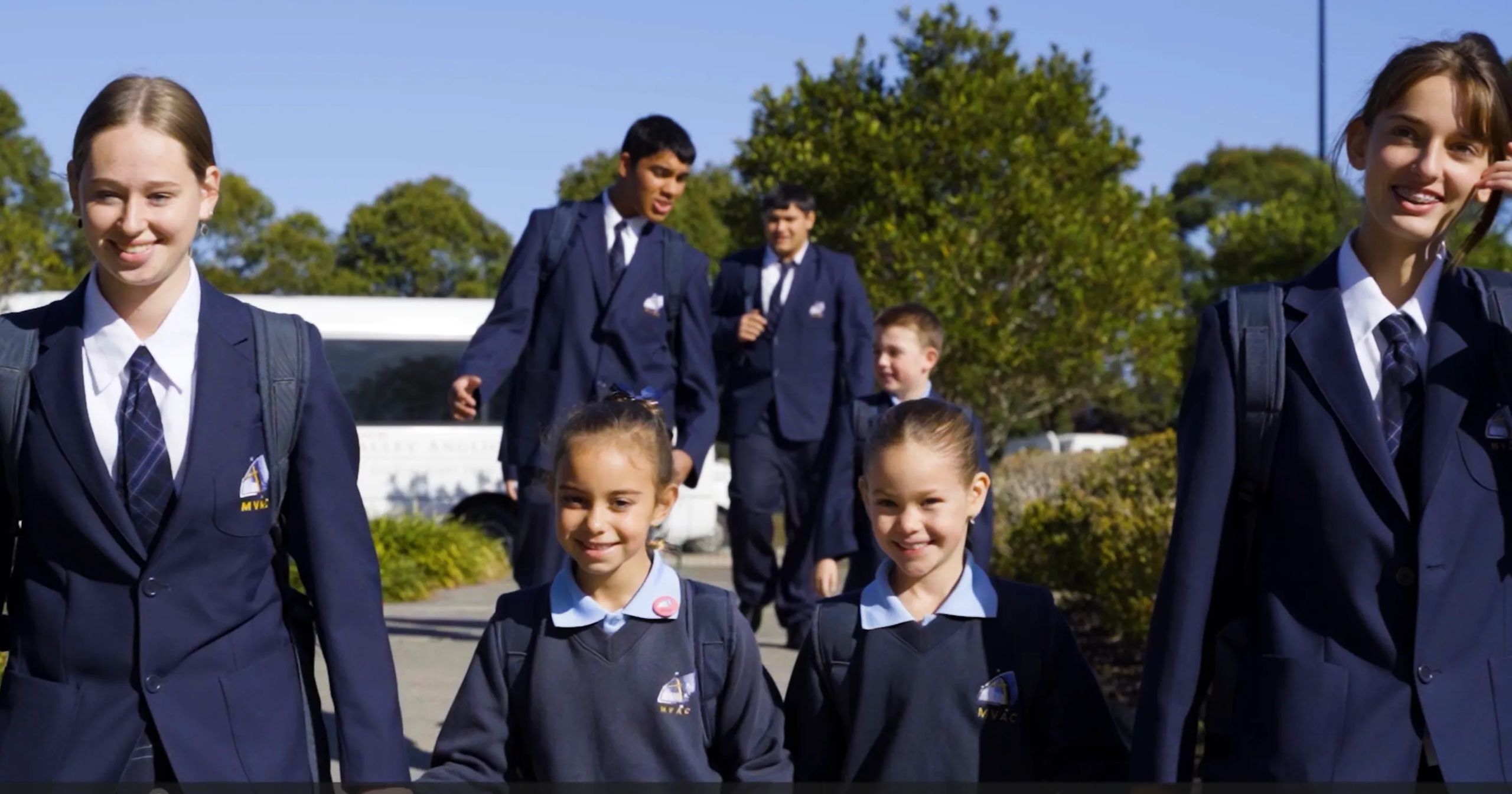 Senior and Junior Students walking into the College to begin a day of learning.